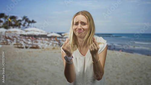 Canvastavla Woman showing pleading hands with open palms and white dress in a studio backdrop of beach; vulnerability distress
