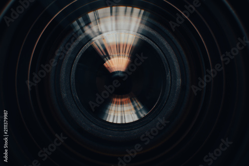 Konstfotografi Abstract Close-up of Camera Lens Element with Green Flares,Macro,Close-up abstract view of a camera lens element featuring intricate internal glass reflections, concentric rings, and vibrant green
