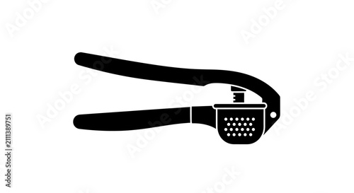 Fotografía Black garlic press on white background with kitchen cooking utensil symbol desig