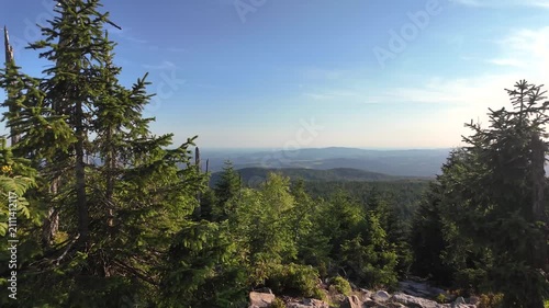 Sunset panorama from the Himmelsleiter on Mount Lusen overlooking the Bavarian Forest in golden summer light