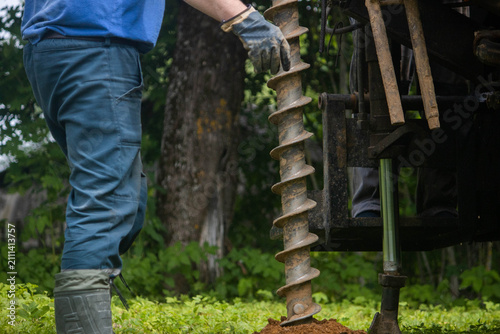 engineering geological surveys, environmental soil analysis, a drill drills into the soil	
