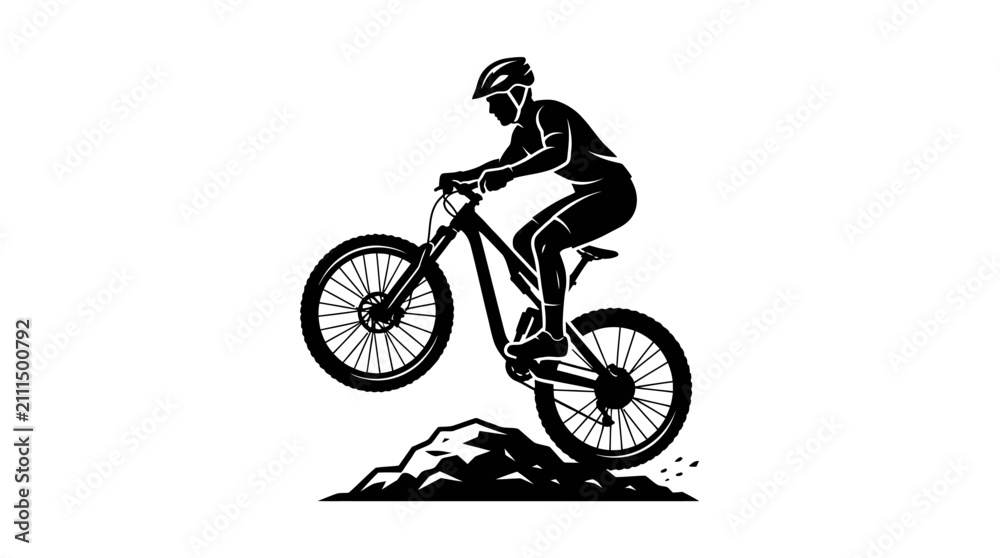 Fototapeta premium Mountain biker performing a jump on rocky terrain.