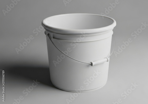 A clean white plastic bucket with a metal handle on grey background