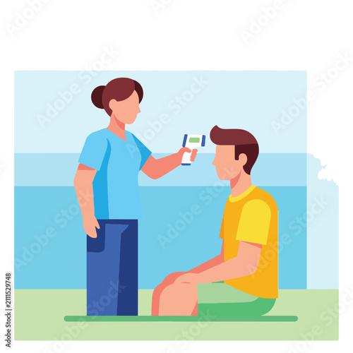 Person taking temperature of another person with infrared thermometer