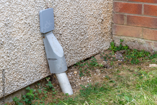 Fotografie Completed fibre entry bracket with trunking on pebbledash exterior wall after FT