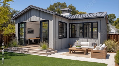 A modern farmhouse ADU nestled in a backyard combines clean architectural lines, warm natural textures, and timeless design to create peaceful, refined contemporary living.