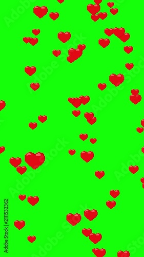 Falling red pixel hearts on a green background. 8-bit hearts on chroma key. Vertical video.