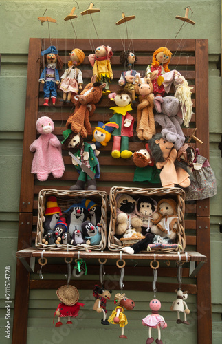 Photography Traditional wooden marionettes and plush puppets displayed outside souvenir shop in Bratislava