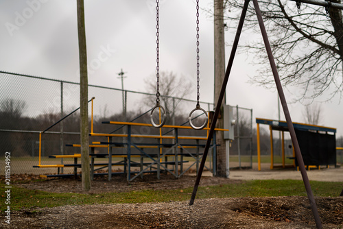 Принти на полотні empty swing at the ballpark