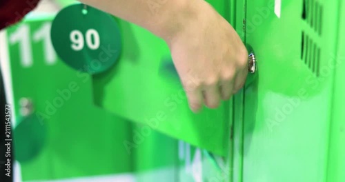 locking a storage locker at the supermarket entranc