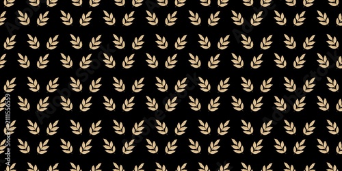 Konstfotografi Golden yellow autumn leaf silhouettes organised densely on a solid dark black backdrop sheet