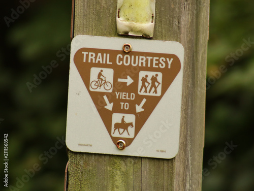 Canvas Print Sign on a trail about trail courtesy about who should yield to who