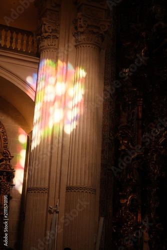 beautiful stained glass colorful light reflecting inside seville cathedral, the largest Gothic cathedral in the world