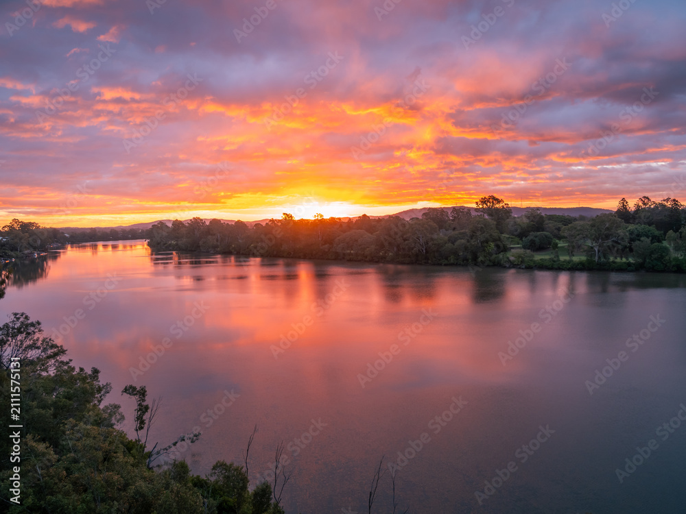 Obraz premium Sunset on the River with Cloud Reflections