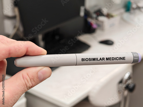 BIOSIMILAR MEDICINE medical concept with an autoinjector in pharmaceutical research laboratory