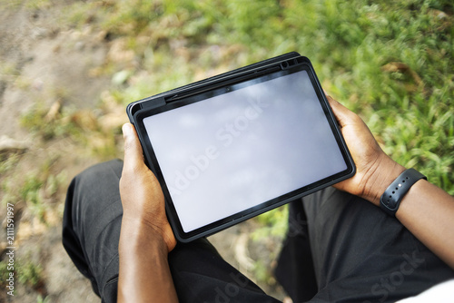 A person using an electronic tablet