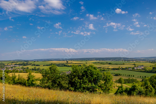 Fotografie Summer landscape, The terrain of hilly countryside, A hamlet on hillside with gr