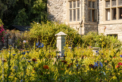 Obraz na plátně Vibrant Gardens, Stone Statue, and Memorial Plaque at Historic Hatley Castle
