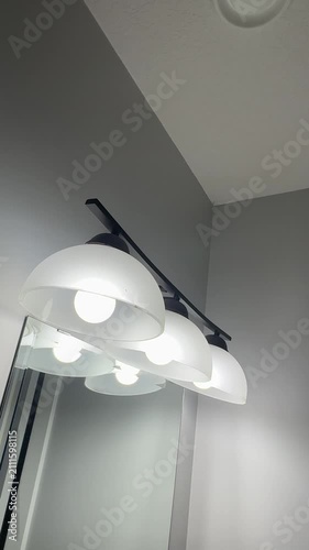 Residential Bathroom Light Fixture Illuminating a Modern Home Interior