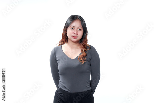 Calm Indonesian Woman Standing with Neutral Expression
