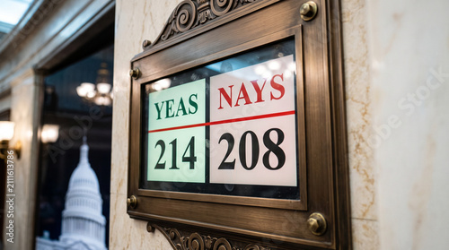 Voting tally board showing yeas and nays results at the United States Capitol. Electronic vote count display for legislative session. Government decision and political policy process.