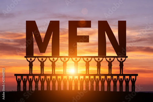 Numerous small figures silhouetted in the morning sun, holding up MFN