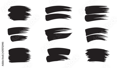 Collection of various black grunge brush stroke shapes isolated on white background for design decoration use.