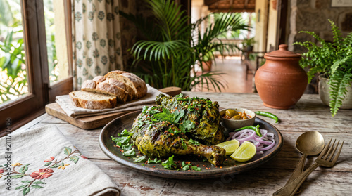 Authentic Goan Chicken Cafreal served with crusty bread and fresh garnishes