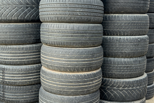 Stacked used car tires for recycling and pollution control.