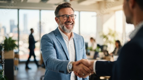 Professional business men shaking hands in a modern office environment