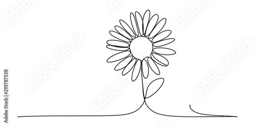 Continuous single line drawing of a simple daisy flower on a flat surface