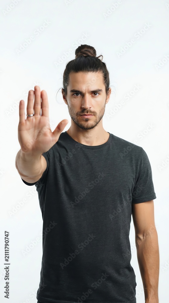 Naklejka premium Young Man with Long Hair and Beard Showing Stop Gesture.