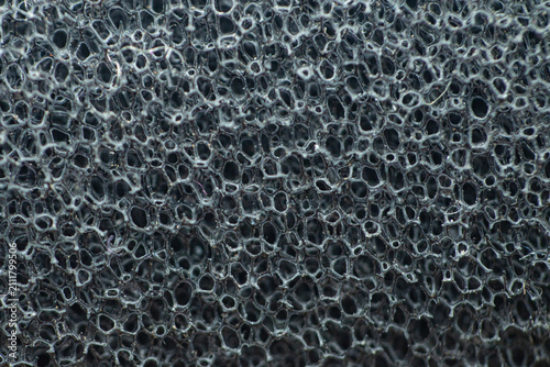 Obraz na płótnie Close-up of porous black sponge texture for background or design