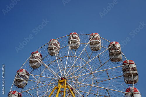 Ferris wheel Player of the fun kids with blue sky,Old and vintage Ferris wheel