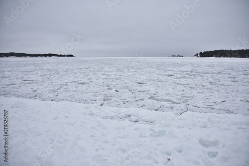 Canvastavla Vast expanse of frozen Lake Vnern near ml, Sweden, featuring a textured surface