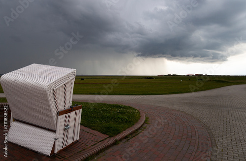 Beach Chair at Dusk with an Approaching Rain Front
