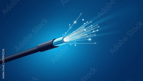 Close up of glowing fiber optic cable emitting bright light on blue background.