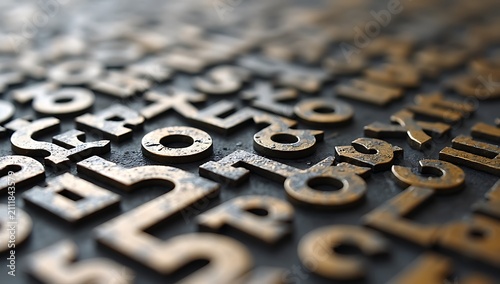 Close-up of vintage metal letterpress type characters arranged in rows.