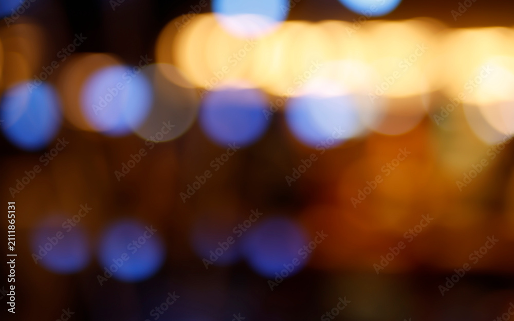 Fototapeta premium Abstract soft defocused bokeh lights with colorful glowing circles and warm illumination. Nightlife, festive background, cinematic overlay, holiday atmosphere, creative backdrop