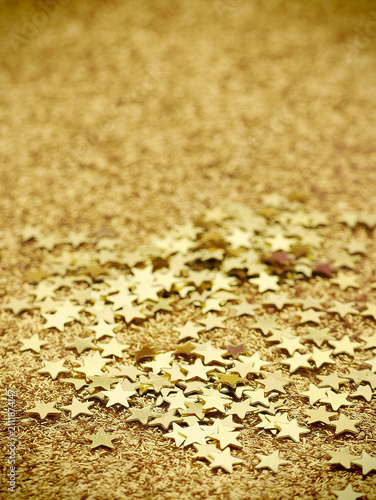 Fotografie Small gold stars background  with shallow dof and copy space