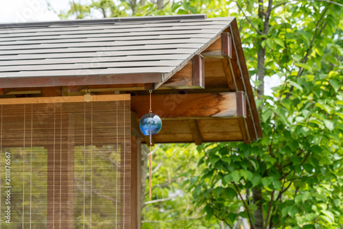Fotografie Glass Wind Chime Hanging Under Japanese House Eaves in Summer