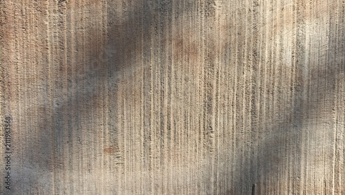 Foto Wood Texture Background featuring a warm brown weathered wooden surface with ver