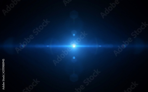 Bright blue lens flare effect with glowing light streaks on a dark black background