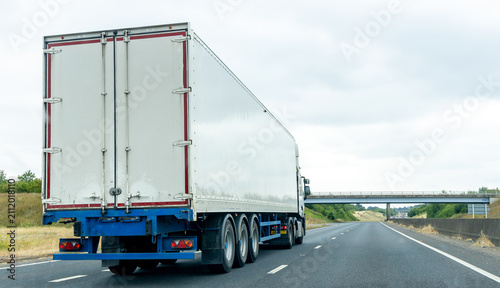 Heavy Goods Vehicles Transporting Freight On UK Motorway