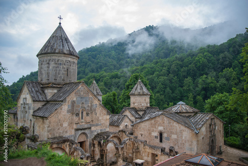 Ancient Haghartsin monastery in misty mountains of Armenia with copy space