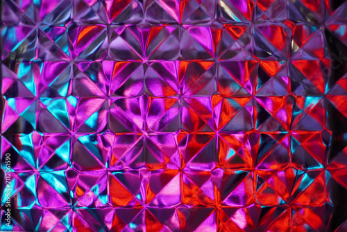 Light and color purple, red, and blue reflected and shifted across the cube's surface like a diamond, revealing a unique beauty that creates a modern and futuristic feel.
