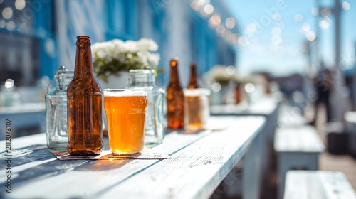 A bright outdoor rooftop beer setup on a whitewashed summer table under soft daylight with refreshing brewery-inspired styling