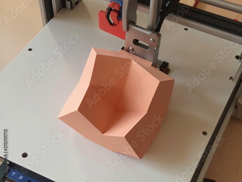 Pink geometric vase fabricated on printer bed