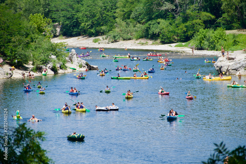 Obraz na płótnie Hundreds of kayakers paddling on the Ardèche River during the summer tourist season
Editorial description
