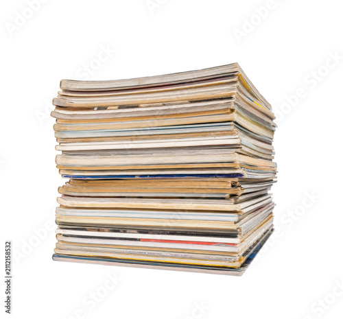 Cuadro en lienzo Thick stack of old magazines and periodicals piled up against a white background